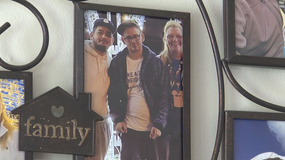 Donna Rhorer, right, stands with her brother TJ Hoover, center, in a family picture.