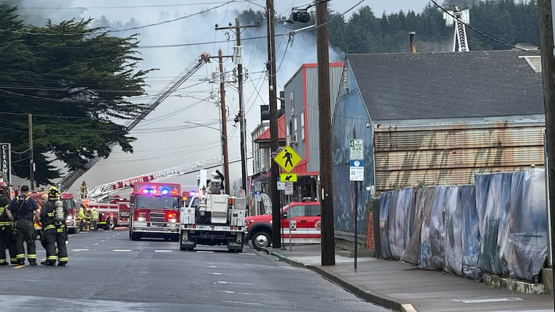 Crews battling a large fire at the Pacific Seafood plant on the Newport Bayfront on Oct. 25,...