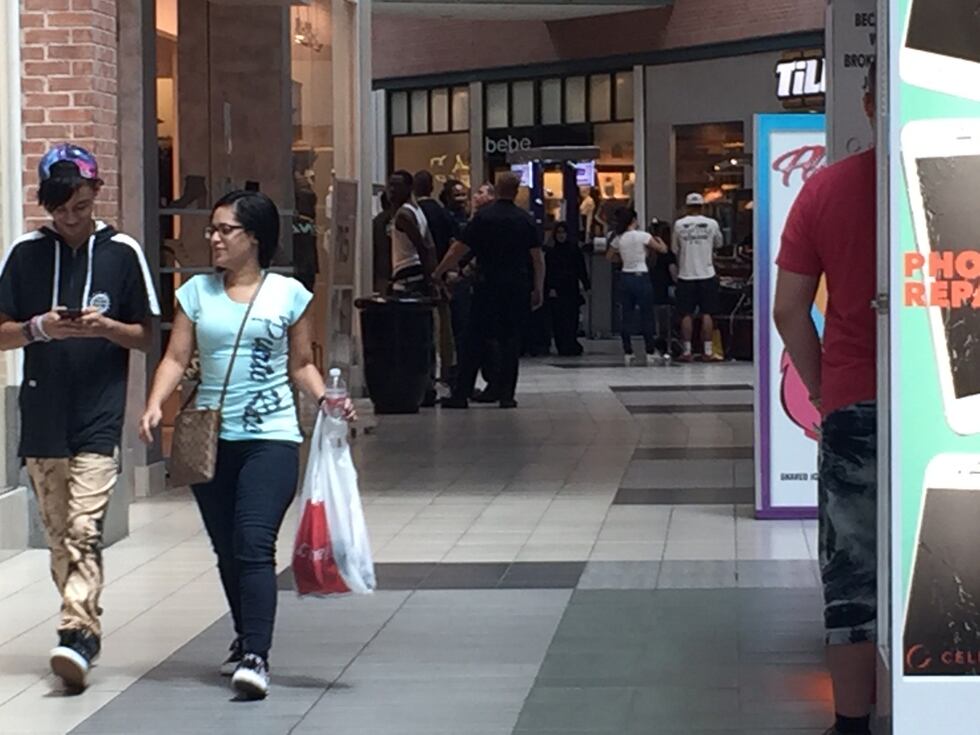 Men being arrested while shoppers go about their day inside Wolfchase Galleria. (Source: WMC...