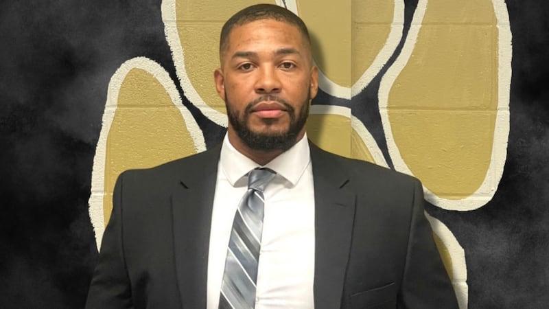 Authorities say coach Darius Robinson has been charged with simple battery and two counts of...