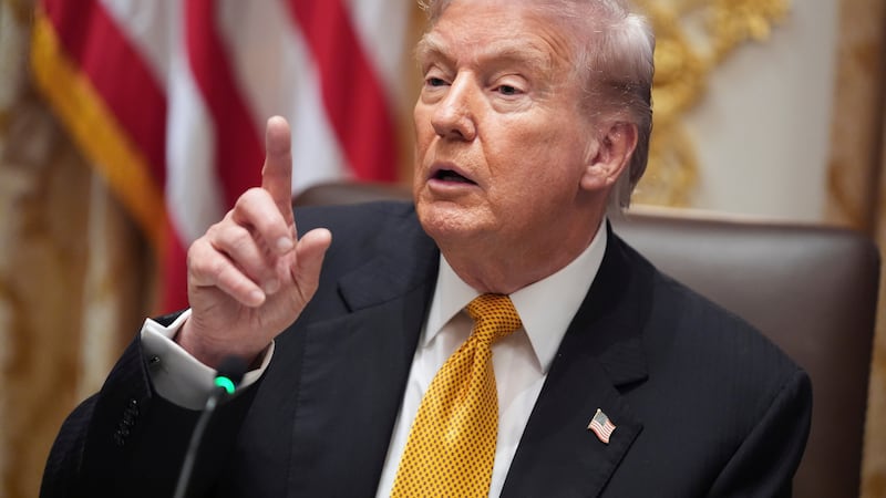 President Donald Trump speaks with reporters during a meeting with Hungary's Prime Minister...