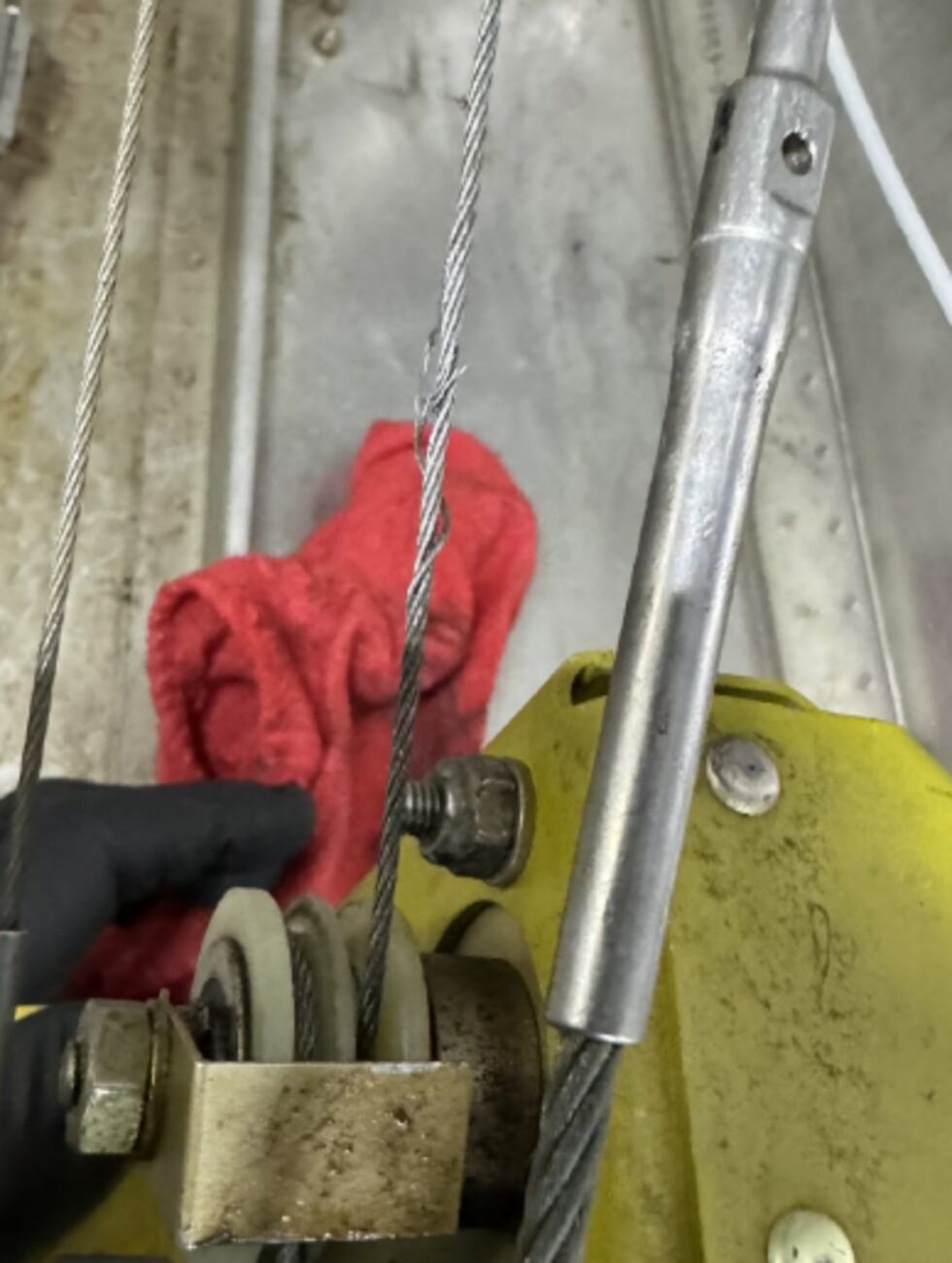 Photo of frayed pitch trim cable before plane crash in Stone County.