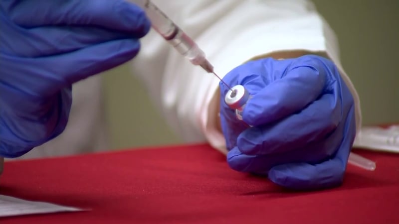 FILE -- COVID-19 vaccine and boosters.