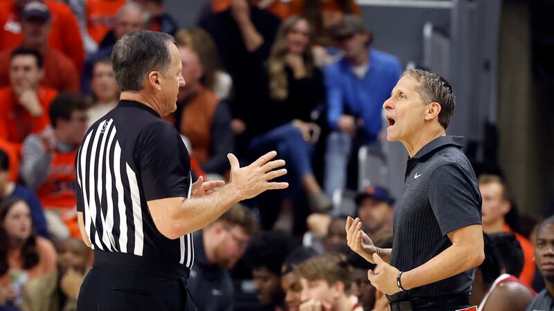 Arkansas coach Eric Musselman talks with a referee about a call during the second half of the...