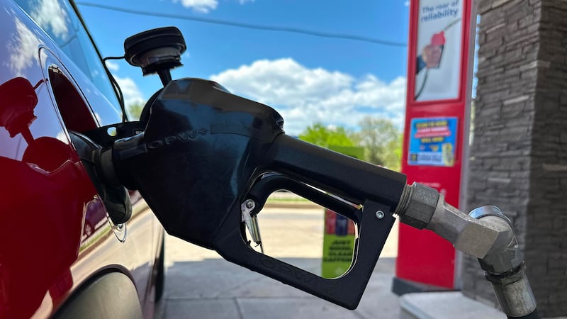 A pump fills up the tank of a vehicle at an Exxon gasoline station in Litttleton, Colo.,...