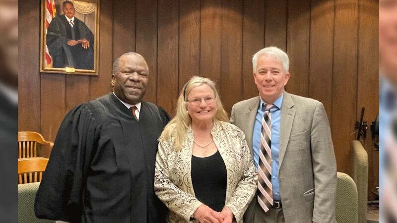 Donna Fields, next to Judge Coffee (L) and DA Mulroy (R)