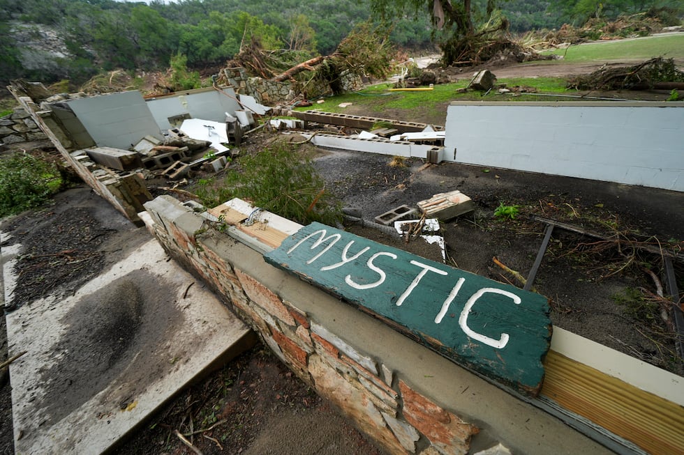 A Camp Mystic sign is seen near the entrance to the establishment along the banks of the...