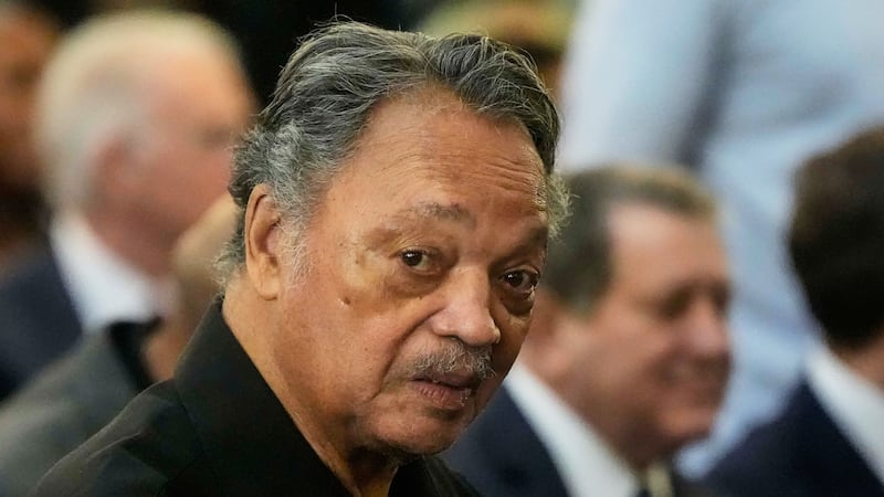 FILE - The Rev. Jesse Jackson listens to speakers at the Tabernacle Baptist Church during the...