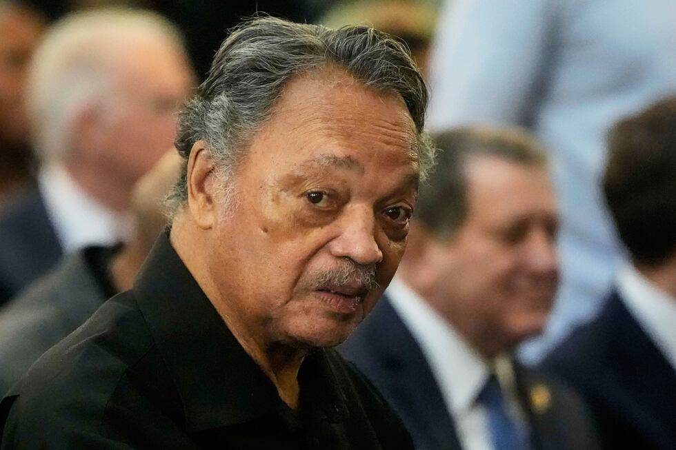 FILE - The Rev. Jesse Jackson listens to speakers at the Tabernacle Baptist Church during the...