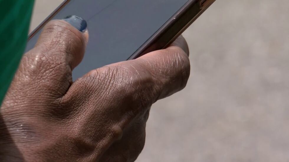 A woman holding a cell phone