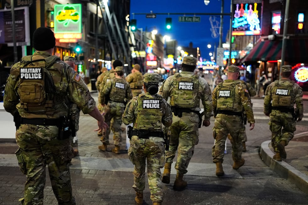Members of the National Guard conduct a community safety patrol on Beale Street, Friday, Oct....