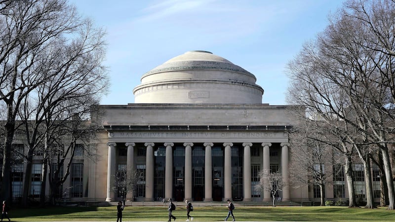 FILE - Students walk past the "Great Dome" atop Building 10 on the Massachusetts Institute of...